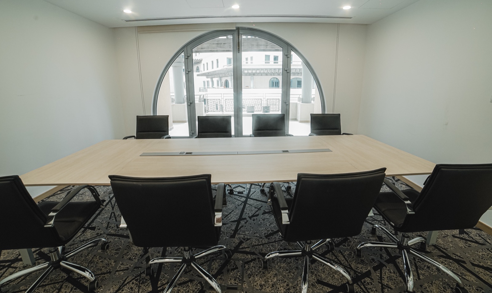 Twelve-seat boardroom with arched window